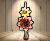 Planet Pleasures Bird Tower: Multi-level bird toy made from natural materials like palm leaves and coconut shells, designed to engage parrots in foraging and chewing activities.