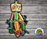 Planet Pleasures Firecracker Bird Toy, a shreddable natural parrot toy with a stuffed pinata top, palm leaf pinatas, and stars for chewing and shredding enrichment.