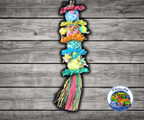 Planet Pleasures Flower Tower Bird Toy made from woven palm leaf with four stuffed pinatas, stars, small square pinatas, and stuffed boxes for chewing and shredding enrichment.