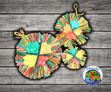 Planet Pleasures Happy Holly Toy, a colorful woven palm leaf flower-shaped bird toy with thin strips for shredding, foraging, and preening enrichment.