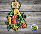 Planet Pleasures Firecracker Bird Toy, a shreddable natural parrot toy with a stuffed pinata top, palm leaf pinatas, and stars for chewing and shredding enrichment.