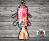 Planet Pleasures Pinata Spiked Bird Toy, a colorful hanging palm leaf pinata toy with bright streamers and fibers for chewing and shredding enrichment.